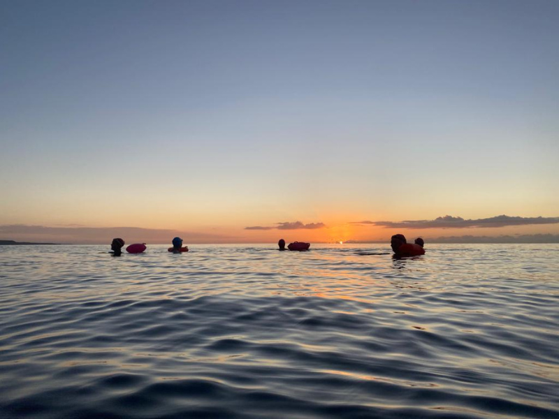 Open water swimming links between cold water swimming, mental wellbeing, menopause support, resilience, community and connection to nature.